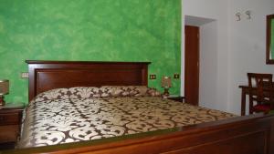 Postel nebo postele na pokoji v ubytování Albergo Miramonti