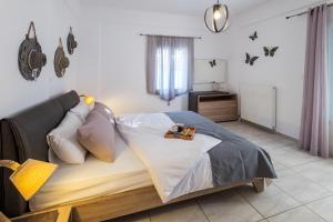 Posteľ alebo postele v izbe v ubytovaní Paros Villas Nereids