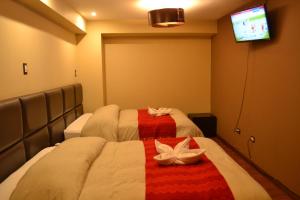 Katil atau katil-katil dalam bilik di Hotel Royal Qosqo