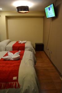 Katil atau katil-katil dalam bilik di Hotel Royal Qosqo