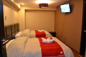 Katil atau katil-katil dalam bilik di Hotel Royal Qosqo