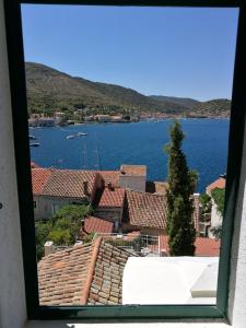 a view from a window of a town and water at Buena Vis-ta Apartments with the Sea View in Vis