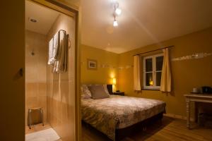 Postel nebo postele na pokoji v ubytování B&B La Clé du Sud