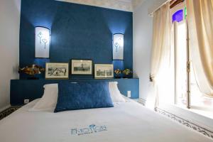 Ein Bett oder Betten in einem Zimmer der Unterkunft Riad Emotion