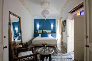 Ein Bett oder Betten in einem Zimmer der Unterkunft Riad Emotion