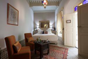 Ein Bett oder Betten in einem Zimmer der Unterkunft Riad Emotion
