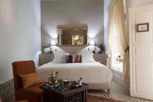 Ein Bett oder Betten in einem Zimmer der Unterkunft Riad Emotion