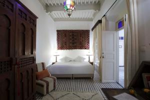 Ein Bett oder Betten in einem Zimmer der Unterkunft Riad Emotion