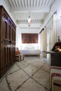 Ein Bett oder Betten in einem Zimmer der Unterkunft Riad Emotion