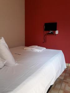 Voodi või voodid majutusasutuse Novo Hotel toas