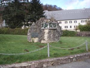 a large rock sitting on top of a field at Albergue Irugoienea in Espinal-Auzperri