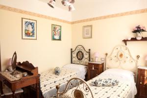 A bed or beds in a room at B&B L' Antica Fonte