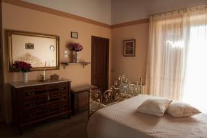 A bed or beds in a room at B&B L' Antica Fonte