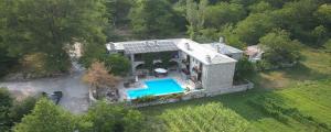 an aerial view of a house with a swimming pool at Lefteri's & Loukia's Guesthouse in Neraida