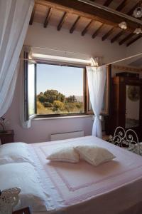 A bed or beds in a room at B&B L' Antica Fonte