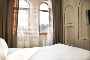 Postel nebo postele na pokoji v ubytování Hotel Khanaka