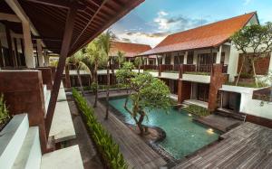 an overhead view of the courtyard of a house with a swimming pool at Arena Living in Sanur