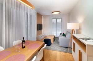 TV a/nebo společenská místnost v ubytování Apartments Residence Grand