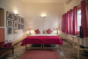 Ένα ή περισσότερα κρεβάτια σε δωμάτιο στο Haveli Hauz Khas