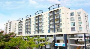 a large white apartment building with a lot of windows at Family Suite@DESA TEBRAU *IKEA *AEON *TESCO *HERO in Johor Bahru