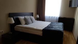 Кровать или кровати в номере Soprano apartment