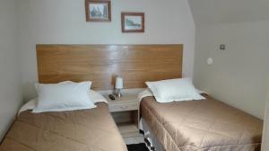 Cama o camas de una habitación en Hotel Herencia