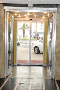 an open door of a building with a car outside at Star City Hotel in Istanbul