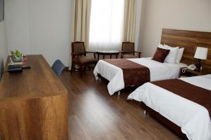 Postel nebo postele na pokoji v ubytování Hotel Nutibara + 37 fotografií