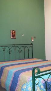 Ένα ή περισσότερα κρεβάτια σε δωμάτιο στο Villa a San Vito lo Capo Minaudo