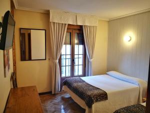 Postel nebo postele na pokoji v ubytování Hostal Alcántara