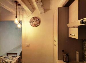 a clock on the side of a wall in a room at San Giorgio degli Schiavoni in Venice +36 photos