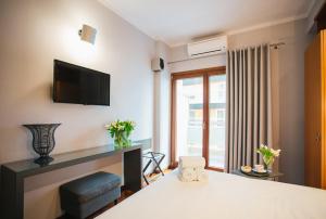 Posteľ alebo postele v izbe v ubytovaní Mitropolitou Iosif Sea View Flat