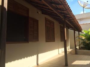 a building with awnings on the side of it at Hospedaria Central Diamantina in Diamantina