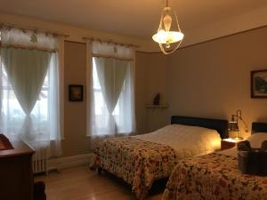 Postel nebo postele na pokoji v ubytování B&B Chez Hubert