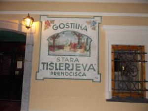 a sign on the side of a wall at Guesthouse Stari Tišler in Ljubljana