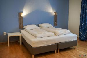 Tempat tidur dalam kamar di Start Keflavík Airport