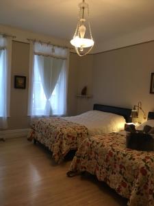 Postel nebo postele na pokoji v ubytování B&B Chez Hubert