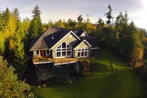 an aerial view of a house on a green lawn at Shawnigan Suite B & B in Shawnigan Lake