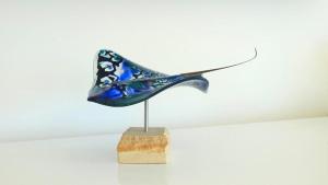 a sculpture of a blue shoe on a stand at Millpond. in Penneshaw