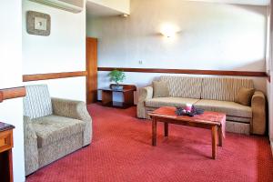 A seating area at Anastassiou Hotel - Bike and motorcycle friendly hotel