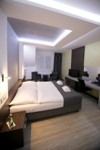 Postel nebo postele na pokoji v ubytování Hotel U Kostela