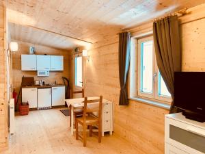 Kuchyň nebo kuchyňský kout v ubytování Mountain Inn Chalets & Apartments
