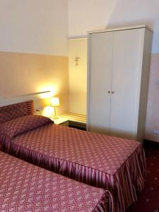 Postel nebo postele na pokoji v ubytování Hotel Internazionale Gorizia