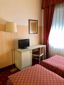 Postel nebo postele na pokoji v ubytování Hotel Internazionale Gorizia