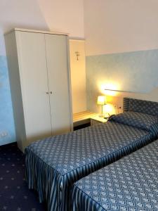 Postel nebo postele na pokoji v ubytování Hotel Internazionale Gorizia