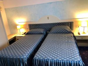 Postel nebo postele na pokoji v ubytování Hotel Internazionale Gorizia