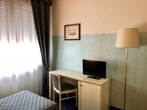 TV a/nebo společenská místnost v ubytování Hotel Internazionale Gorizia