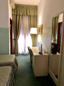 TV a/nebo společenská místnost v ubytování Hotel Internazionale Gorizia