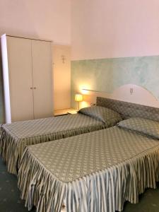 Postel nebo postele na pokoji v ubytování Hotel Internazionale Gorizia
