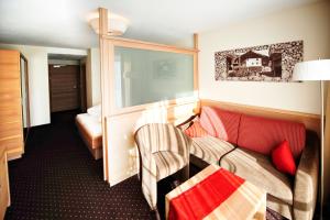 Ένα ή περισσότερα κρεβάτια σε δωμάτιο στο Hotel Röck Garni